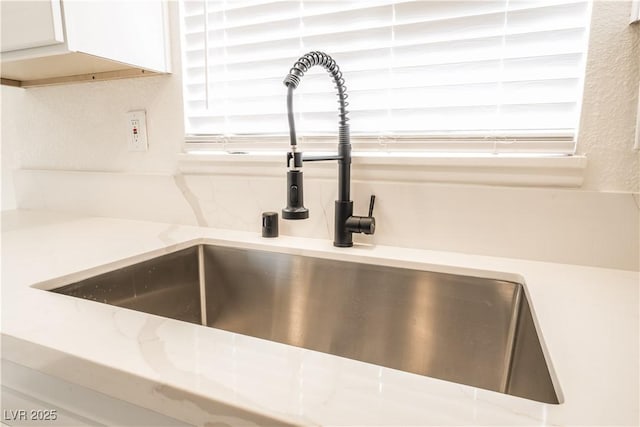 1648 J St, Las Vegas, NV 89106 - kitchen view of white cabinets and light stone countertops
