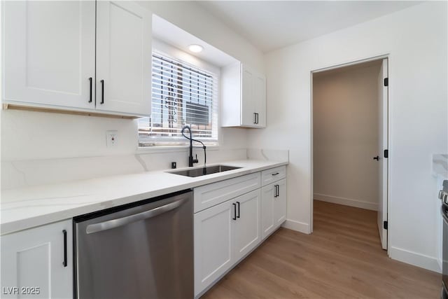 1648 J St, Las Vegas, NV 89106 - kitchen featuring stainless steel dishwasher, white cabinetry, and light wood-style floors