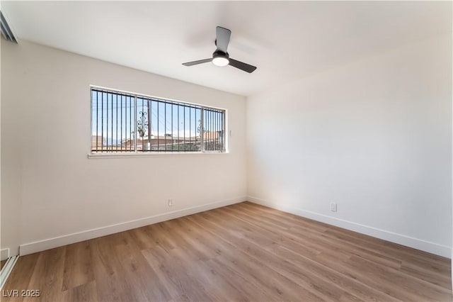 1648 J St, Las Vegas, NV 89106 - spare room featuring wood finished floors and a ceiling fan