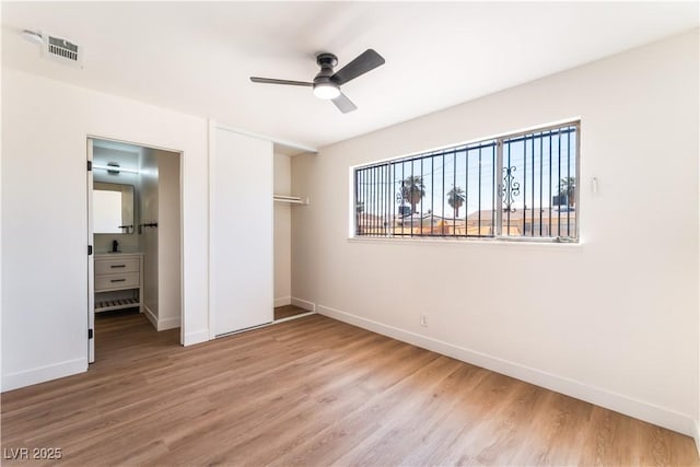 1648 J St, Las Vegas, NV 89106 - unfurnished bedroom with wood finished floors, a closet, and a ceiling fan