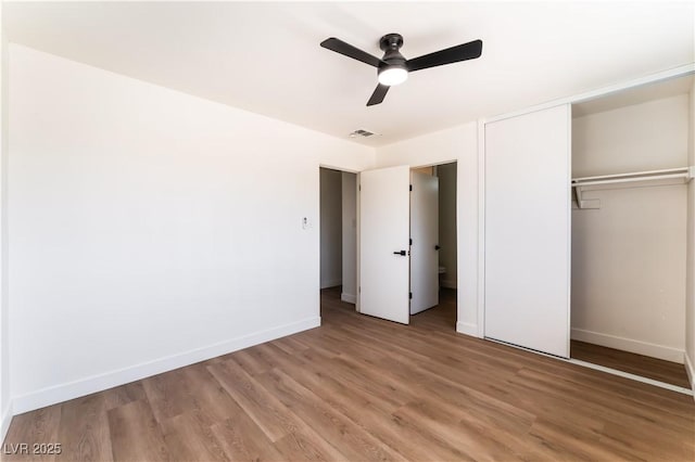 1648 J St, Las Vegas, NV 89106 - unfurnished bedroom with a closet, light wood-style flooring, and a ceiling fan