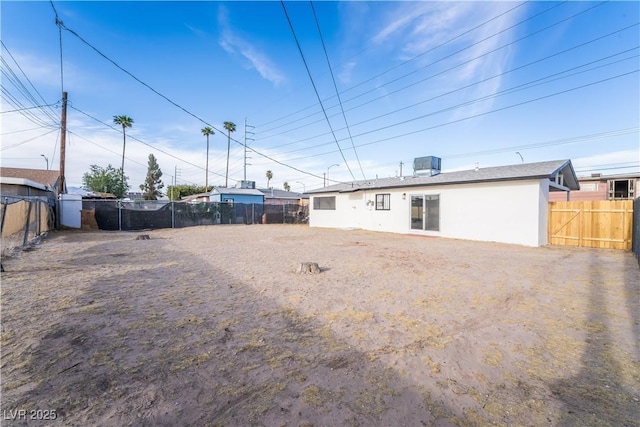 1648 J St, Las Vegas, NV 89106 - rear view of house with a fenced backyard and stucco siding