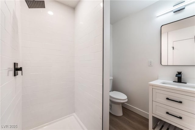 1648 J St, Las Vegas, NV 89106 - full bathroom with wood finished floors, vanity, and a tile shower