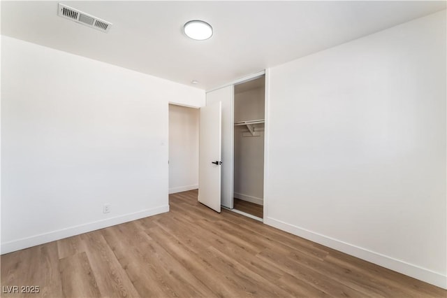 1648 J St, Las Vegas, NV 89106 - unfurnished bedroom with light wood-type flooring and a closet