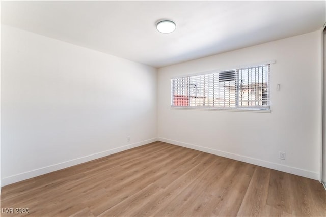 1648 J St, Las Vegas, NV 89106 - empty room with light wood-style flooring and baseboards