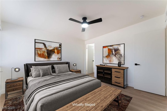 3320 Osage Ave, Las Vegas, NV 89101 - bedroom with light wood-style flooring and ceiling fan