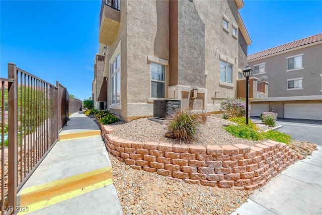 2766 Red Vista Ct, Henderson, NV 89074 - view of home's exterior featuring stucco siding and a cooling unit