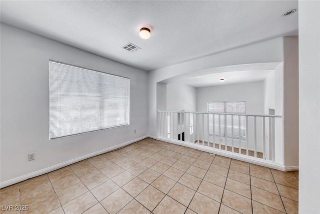2766 Red Vista Ct, Henderson, NV 89074 - empty room with light tile patterned floors and arched walkways