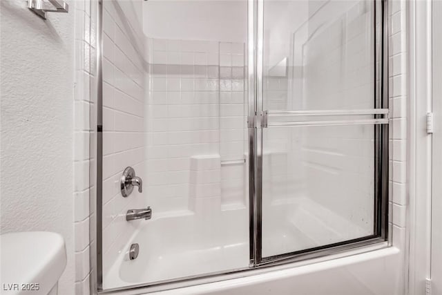 2766 Red Vista Ct, Henderson, NV 89074 - full bathroom featuring bath / shower combo with glass door and a textured wall