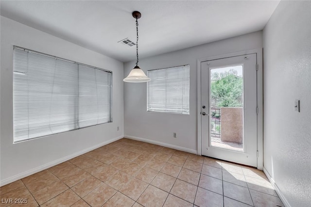 2766 Red Vista Ct, Henderson, NV 89074 - unfurnished dining area with light tile patterned floors and baseboards