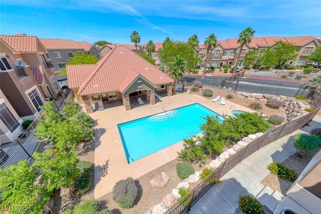 2766 Red Vista Ct, Henderson, NV 89074 - community pool featuring a residential view, a fenced backyard, and a patio