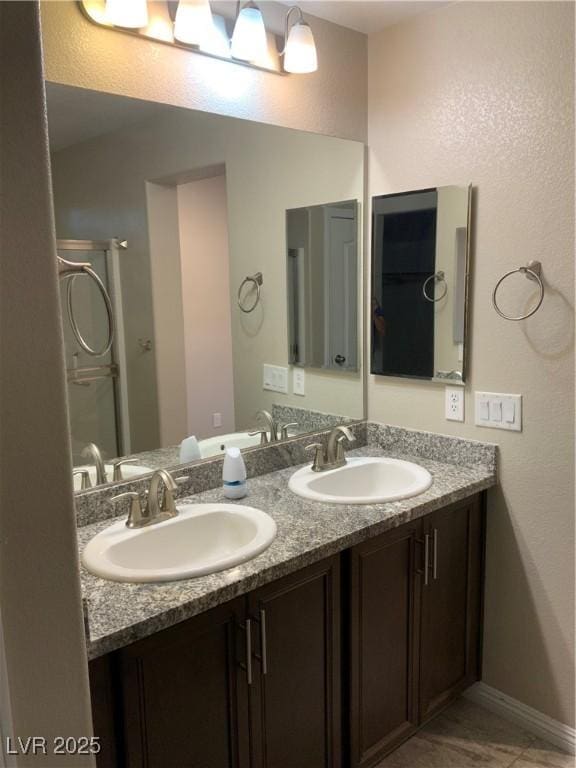 5363 S Juneau St, Pahrump, NV 89061 - bathroom featuring double vanity and baseboards