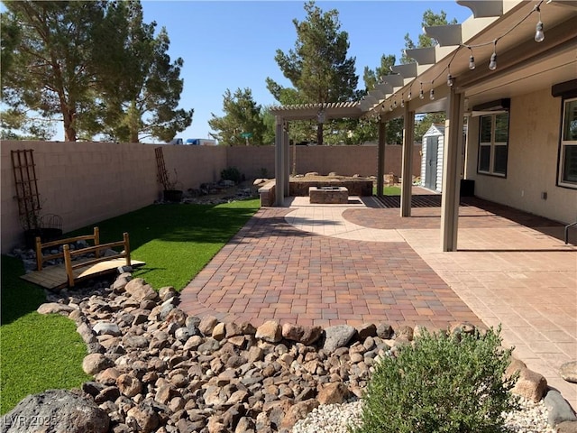 5363 S Juneau St, Pahrump, NV 89061 - fenced backyard with a patio, a pergola, and a storage shed