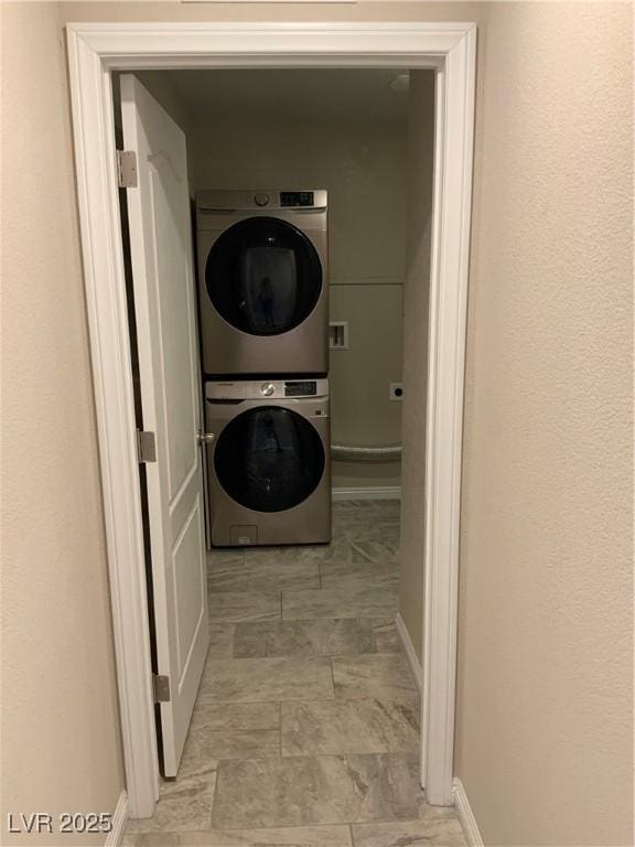 5363 S Juneau St, Pahrump, NV 89061 - laundry room featuring stacked washer / drying machine and baseboards