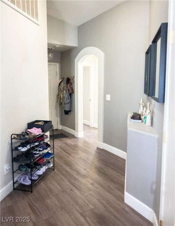 4848 Cutting Diamond Ct, North Las Vegas, NV 89081 - hallway with arched walkways and wood finished floors