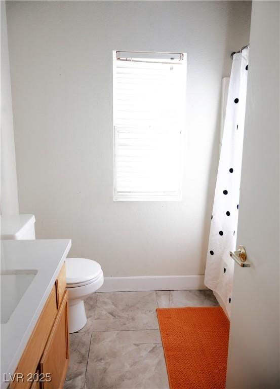 4848 Cutting Diamond Ct, North Las Vegas, NV 89081 - full bathroom with vanity and marble look tile flooring