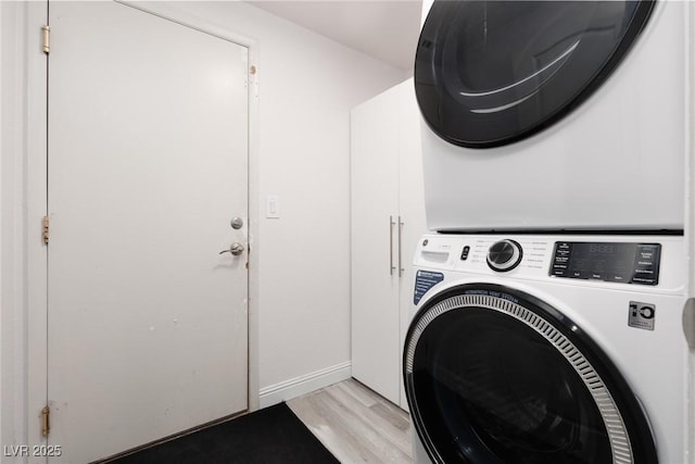 5620 Siena Rose St, North Las Vegas, NV 89031 - laundry area featuring stacked washing machine and dryer and light wood finished floors