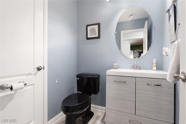 5620 Siena Rose St, North Las Vegas, NV 89031 - bathroom with vanity and wood finished floors