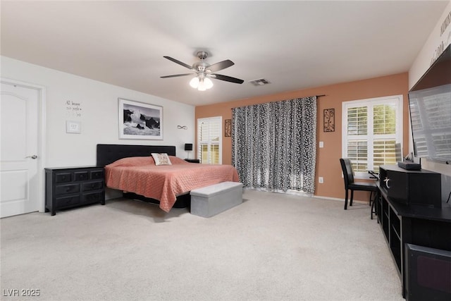 5620 Siena Rose St, North Las Vegas, NV 89031 - bedroom featuring light carpet and a ceiling fan