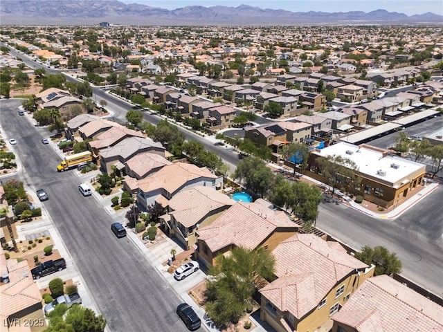 5620 Siena Rose St, North Las Vegas, NV 89031 - aerial perspective of suburban area featuring a mountainous background