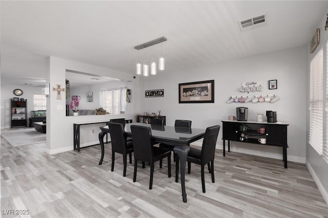 5620 Siena Rose St, North Las Vegas, NV 89031 - dining room with light wood finished floors and baseboards