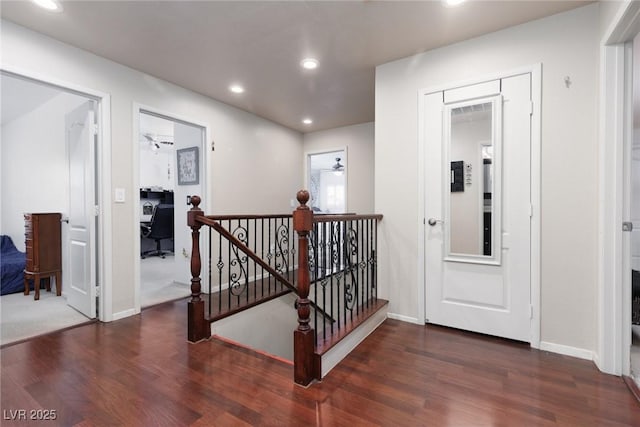 5620 Siena Rose St, North Las Vegas, NV 89031 - hallway with an upstairs landing, dark wood-style floors, and recessed lighting