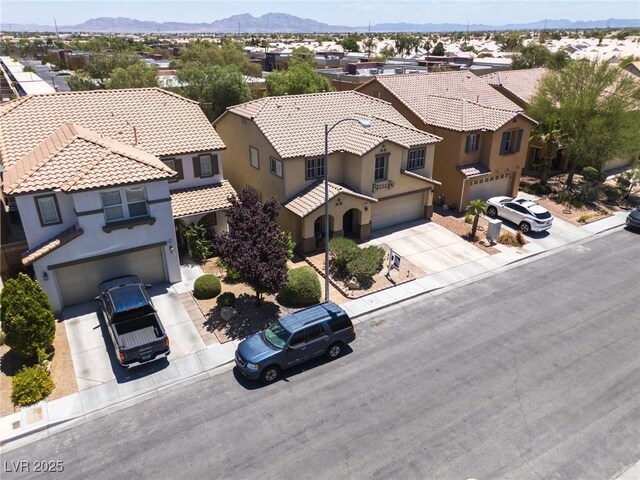 5620 Siena Rose St, North Las Vegas, NV 89031 - aerial view of residential area featuring a mountainous background