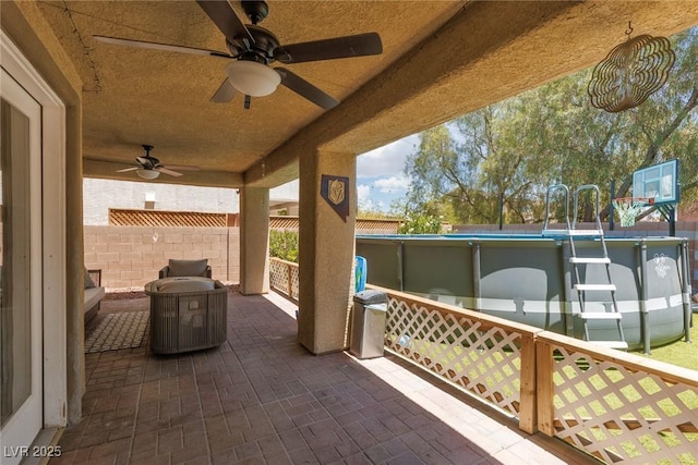 5620 Siena Rose St, North Las Vegas, NV 89031 - view of patio / terrace with a ceiling fan and an outdoor pool