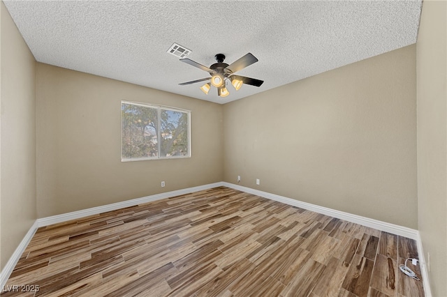 9409 Kayla Ct, Las Vegas, NV 89134 - spare room featuring wood finished floors, a ceiling fan, and a textured ceiling