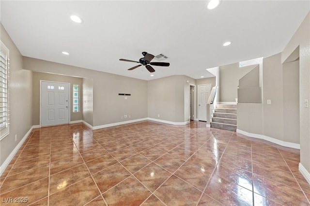 9409 Kayla Ct, Las Vegas, NV 89134 - unfurnished living room with a ceiling fan, recessed lighting, stairs, and tile patterned floors
