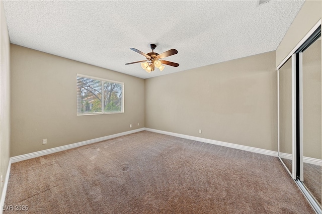 9409 Kayla Ct, Las Vegas, NV 89134 - unfurnished bedroom featuring carpet, a closet, a textured ceiling, and ceiling fan