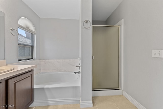 9409 Kayla Ct, Las Vegas, NV 89134 - full bath featuring a shower stall, tile patterned floors, vanity, and a bath