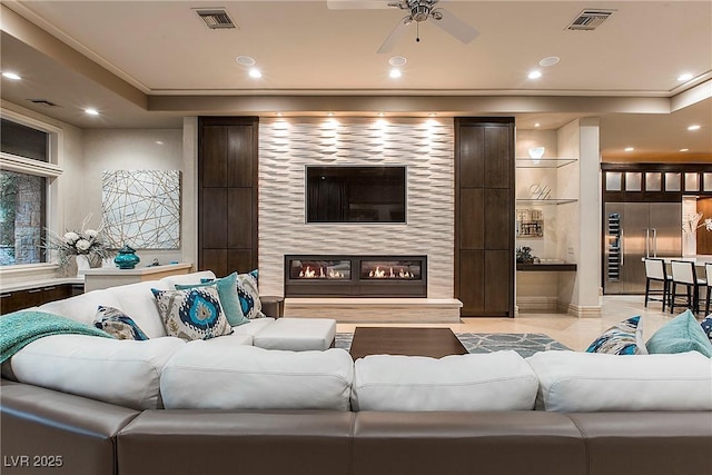 15 Golden Sunray Ln, Las Vegas, NV 89135 - living area featuring recessed lighting, ornamental molding, ceiling fan, and a fireplace