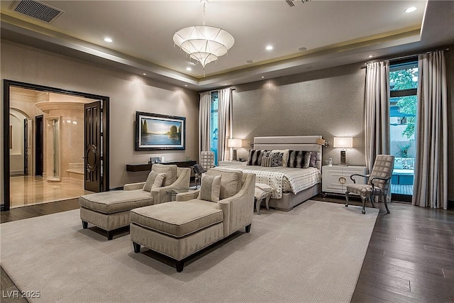 15 Golden Sunray Ln, Las Vegas, NV 89135 - bedroom with a tray ceiling, wood finished floors, and recessed lighting