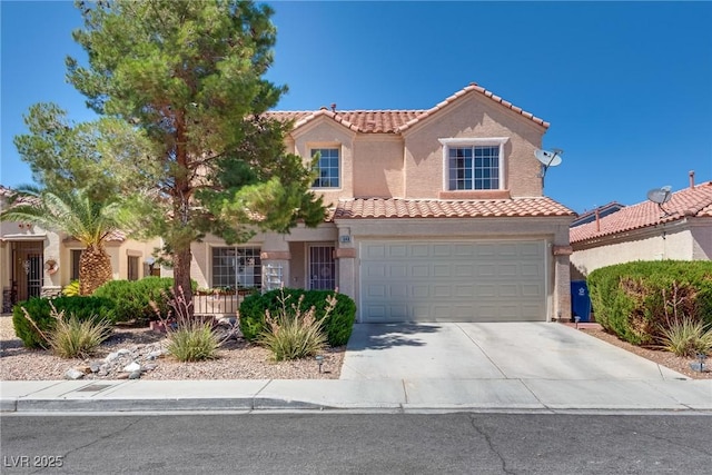 1048 Menands Ave, Las Vegas, NV 89123 - mediterranean / spanish house featuring driveway, a tile roof, stucco siding, and an attached garage