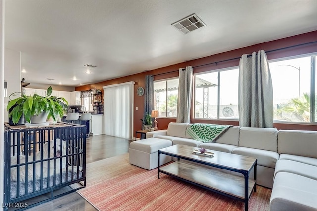 1048 Menands Ave, Las Vegas, NV 89123 - living room with wood finished floors and recessed lighting