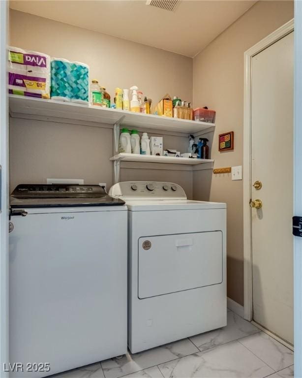 1048 Menands Ave, Las Vegas, NV 89123 - laundry area featuring washing machine and dryer and light marble finish flooring