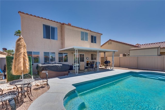 1048 Menands Ave, Las Vegas, NV 89123 - view of swimming pool with a hot tub, a patio area, and a fenced backyard