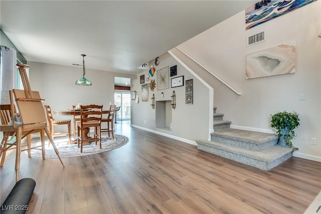 1048 Menands Ave, Las Vegas, NV 89123 - dining room featuring stairs and wood finished floors