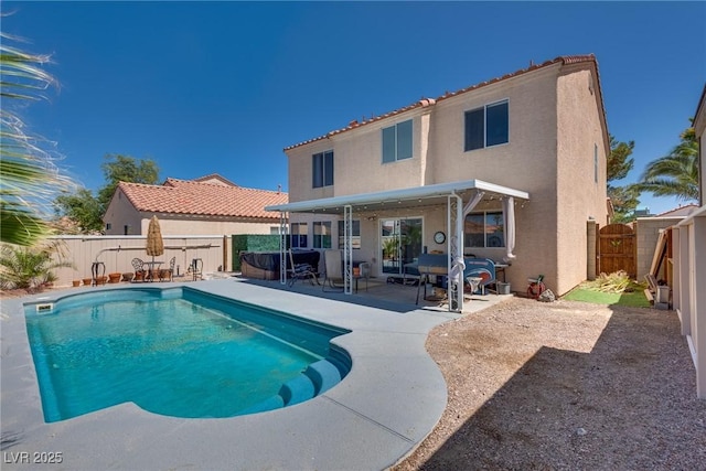 1048 Menands Ave, Las Vegas, NV 89123 - view of swimming pool with a patio area, a fenced backyard, a gate, and a covered hot tub