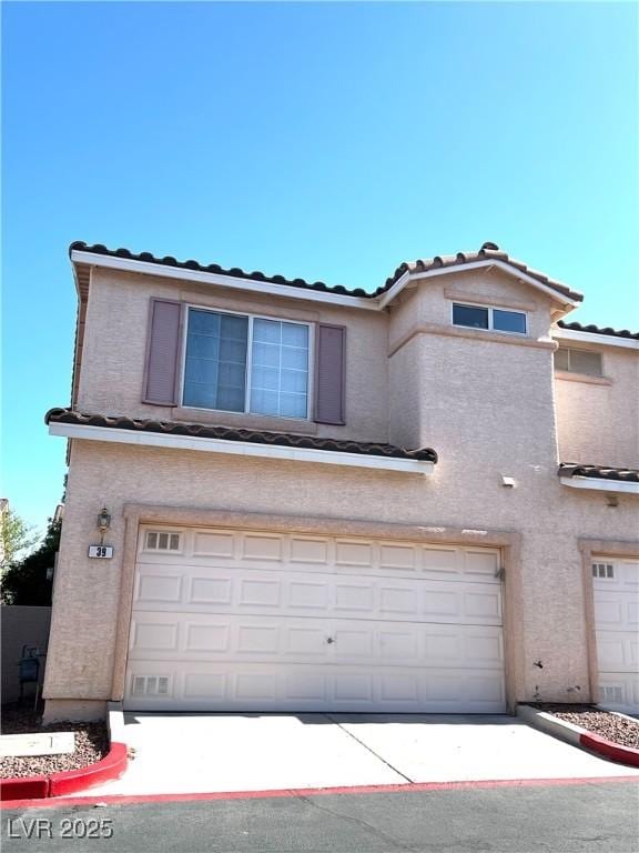 39 Belle La Blanc Ave, Las Vegas, NV 89123 - view of front of property with an attached garage, a tiled roof, and stucco siding