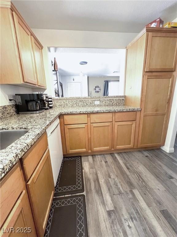 39 Belle La Blanc Ave, Las Vegas, NV 89123 - kitchen featuring dishwasher, light wood-type flooring, and light stone countertops