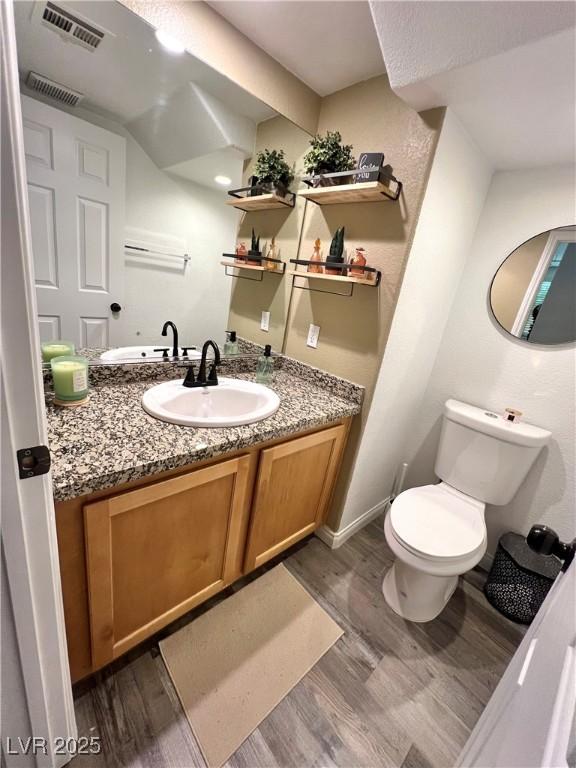 39 Belle La Blanc Ave, Las Vegas, NV 89123 - half bath with wood finished floors and vanity