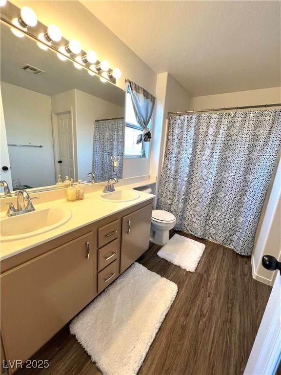 39 Belle La Blanc Ave, Las Vegas, NV 89123 - bathroom featuring wood finished floors and double vanity