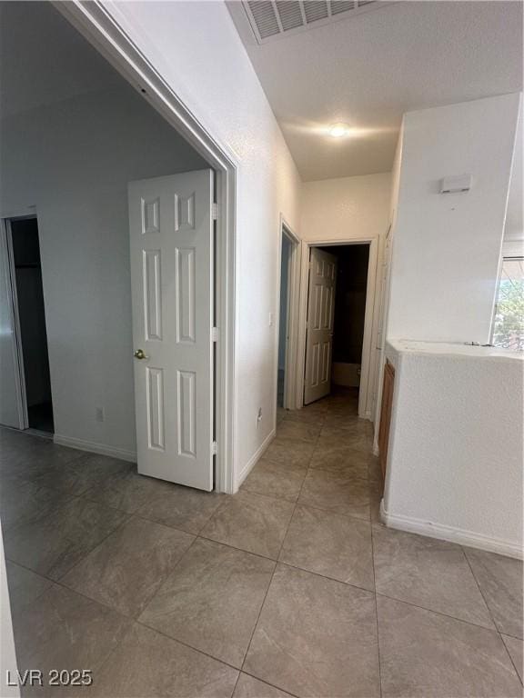 8042 Palace Monaco Ave, Las Vegas, NV 89117 - corridor with light tile patterned floors