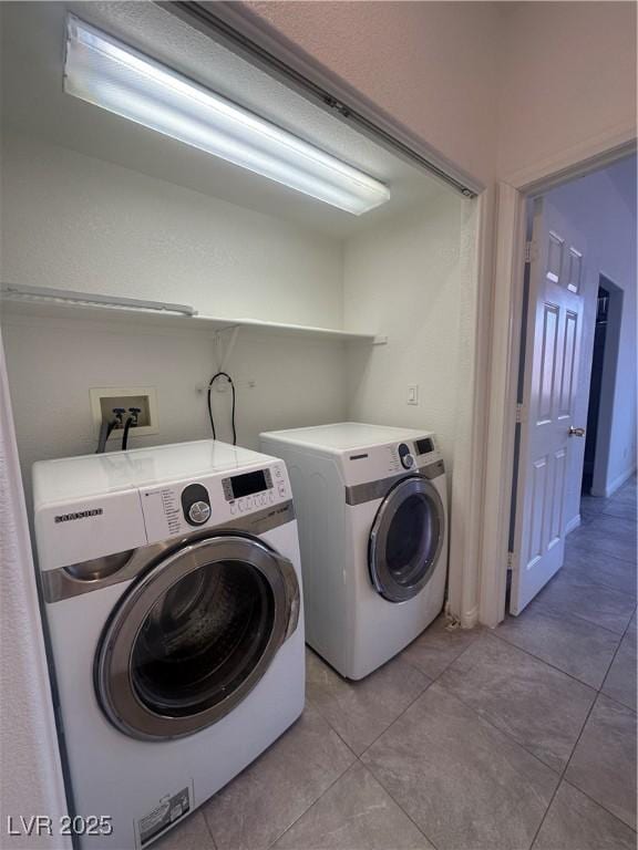 8042 Palace Monaco Ave, Las Vegas, NV 89117 - laundry room with washing machine and dryer and light tile patterned flooring