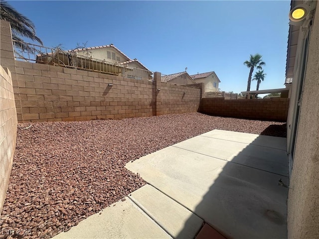 8042 Palace Monaco Ave, Las Vegas, NV 89117 - fenced backyard with a patio
