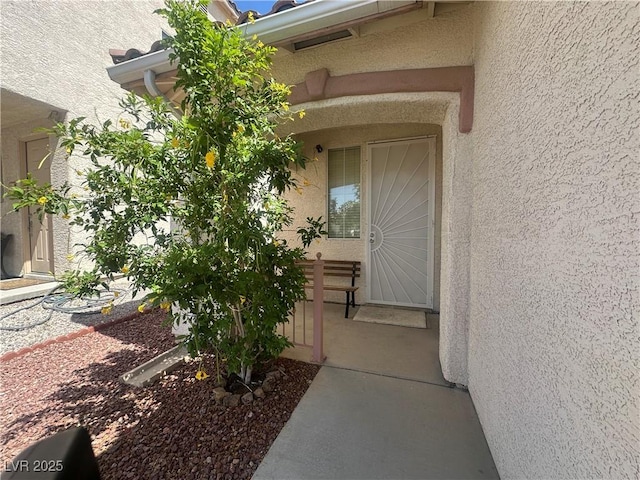 8042 Palace Monaco Ave, Las Vegas, NV 89117 - doorway to property with stucco siding