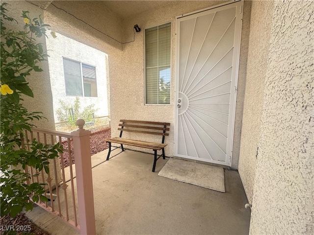 8042 Palace Monaco Ave, Las Vegas, NV 89117 - property entrance featuring stucco siding and covered porch