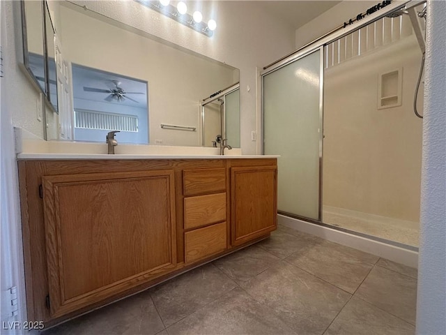 8042 Palace Monaco Ave, Las Vegas, NV 89117 - full bathroom featuring tile patterned flooring, a stall shower, a ceiling fan, and double vanity